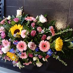 Vibrant casket spray 
