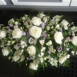 Cream rose casket spray 