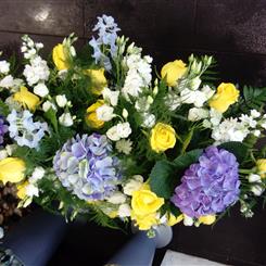 Blue hydrangea casket spray