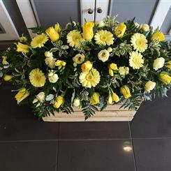 Yellow rose and gerbera casket spray