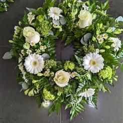 Cream rose and gerbera wreath tribute 