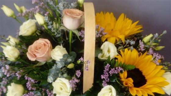 Sarah A sunflower and rose basket arrangement