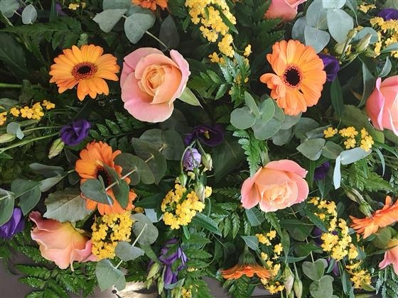 Coral rose casket spray