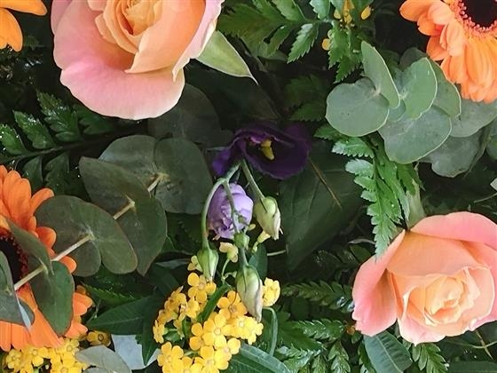 Coral rose casket spray