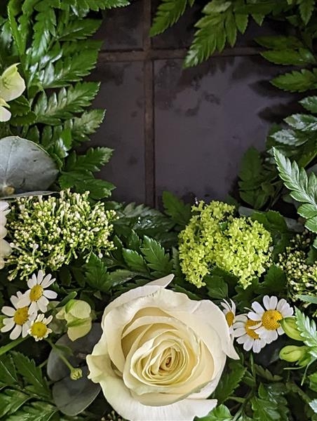 Cream rose and gerbera wreath tribute