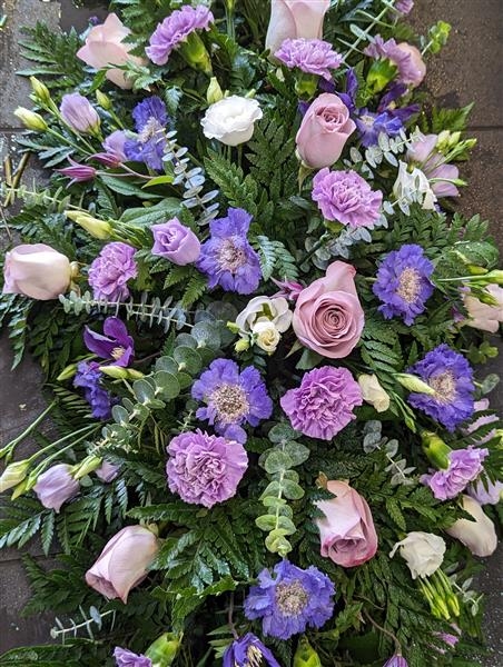 Lilac Rose and carnation casket spray