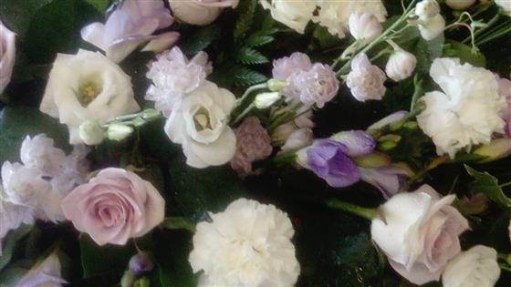 Lilac rose casket spray