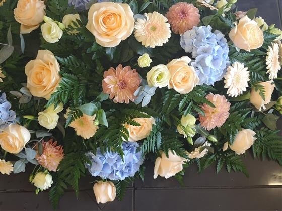 Peach and Blue casket spray