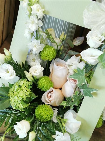 Loretta  A soft collection of peach and cream flowers