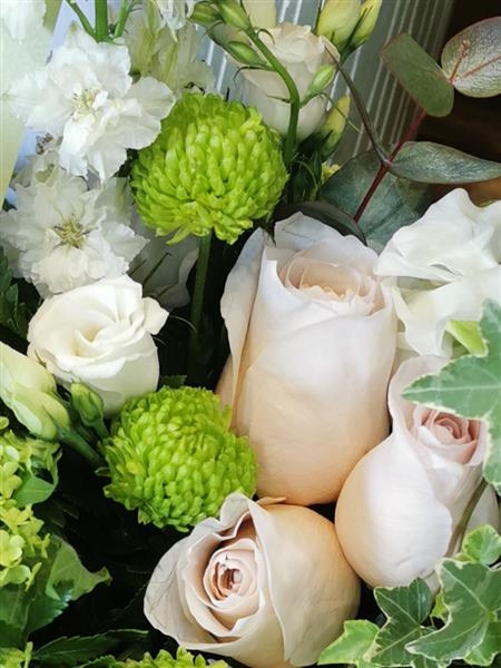 Loretta  A soft collection of peach and cream flowers