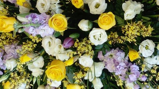 Yellow rose and lilac larkspur casket spray