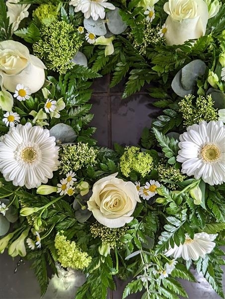 Cream rose and gerbera wreath tribute