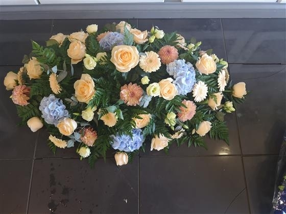 Peach and Blue casket spray