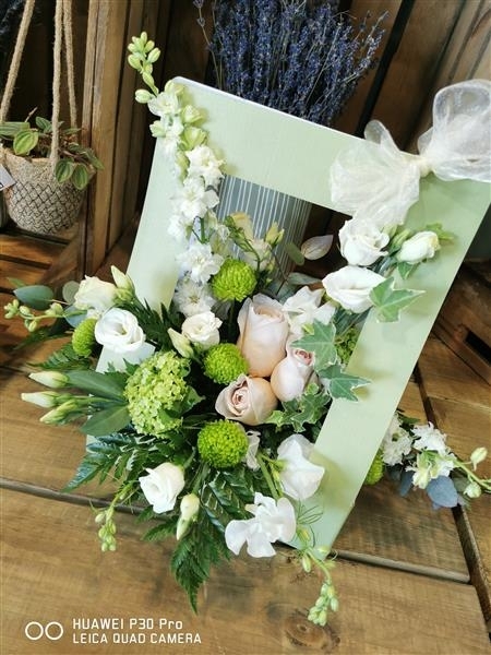 Loretta  A soft collection of peach and cream flowers
