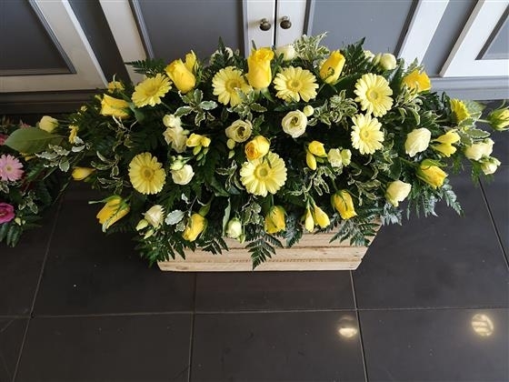 Yellow rose and gerbera casket spray
